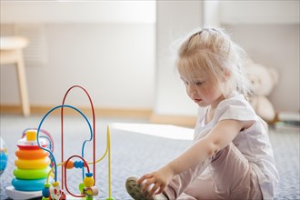 Girl with developing toys