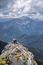 Mountaineer at the summit of Taubenstein