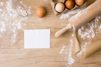 Rolling pin with eggs rack paper flour