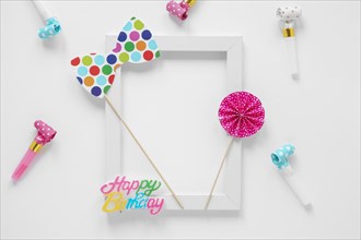 Empty frame with colorful birthday items