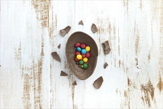 Small candies open chocolate egg table