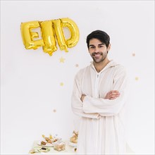 Eid al fitr concept with muslim man