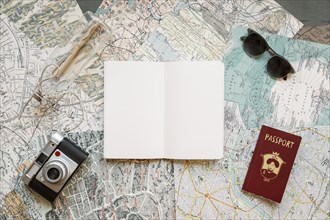 Passport with camera notepad maps