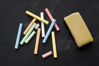 Close up colored chalk with sponge