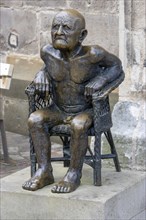 Bronze sculpture The Old Man by Guido Messer in front of the Protestant Town Church