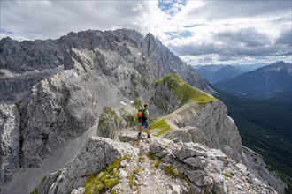 Mountaineer at the summit of the Suedliche Riffelspitze