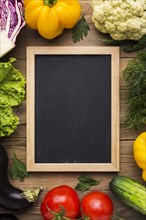 Top view colorful background with vegetables blackboard
