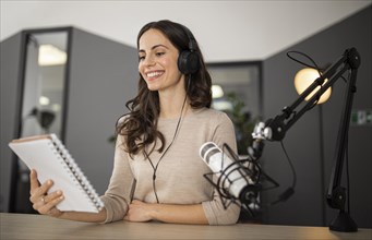 Smiley woman studio during radio show