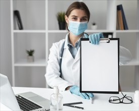 Doctor holding medical clipboard