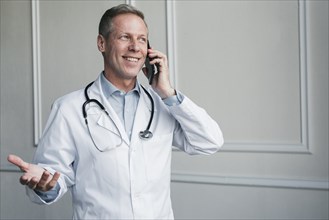 Doctor making phone call