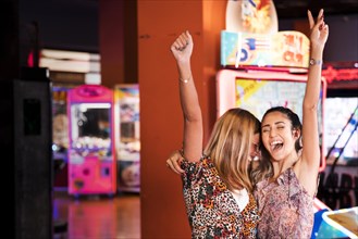 Happy women amusement arcade