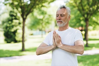 Side view man with hands meditating position