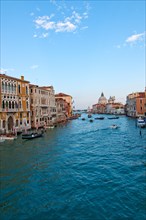 Venice Italy grand canal view from the top of Accademia bridge with Madonna della Salute church on background