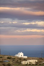 Small white chapel at sunset