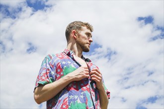 Low medium shot portrait stylish man looking away