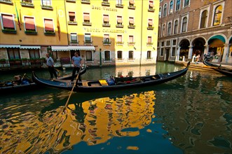 Venice Italy gondolas on canal at parking spot