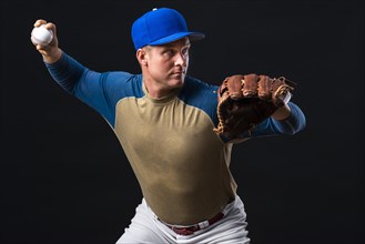 Man posing with baseball glove ball