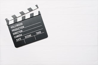 Clapperboard white wooden table