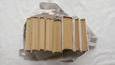 Top view books stack bag