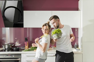 Happy couple indoors kitchen