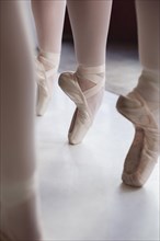Professional ballet dancers training pointe shoes