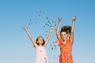 Girls throwing confetti