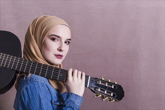 Portrait arab woman with guitar