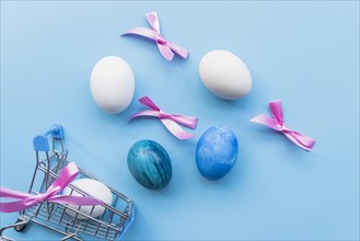 Colored eggs with ribbons cart