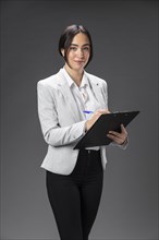 Portrait female lawyer formal suit with clipboard