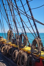 Old wooden Age of sail sailing ship ropes cordage and shroud
