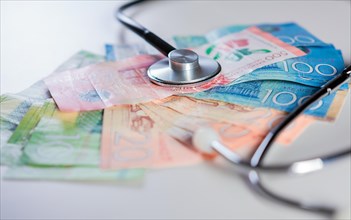 Nicaraguan healthcare cost concept. Stethoscope on Nicaraguan banknotes on white background