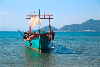 A traditional khmer fishing boat moored off the coast of Koh Tonsay or Rabbit Island in Cambodia