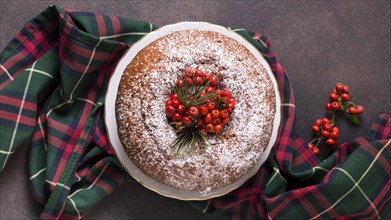 Flat lay christmas cake with red berries