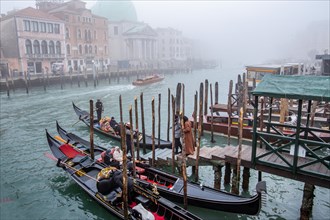 Gondola station on the Grand Canal in winter fog