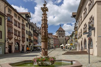 Apostle's Fountain and Old Town with old traditional houses with oriels in Black Forest style and Black Gate