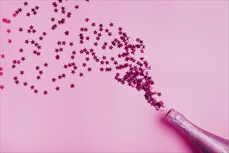 Pink bottle champagne with star form glitter