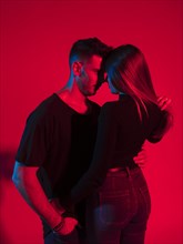 Young man black hugging pretty woman