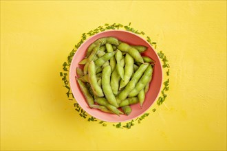 Flat lay edamame beans bowl with fresh cut chives