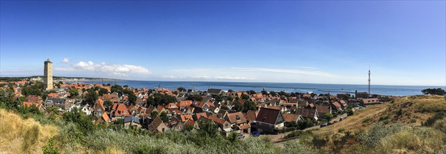 Panorama of the small town of West on Terschelling with the landmark Brandaris and view of the Wadden Sea
