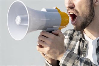 Man with megaphone shouting