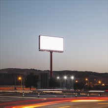 Blank advertising billboards illuminated highway night