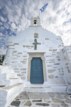 White Greek Orthodox Church Holy Church of Agios Konstantinos with Greek flag