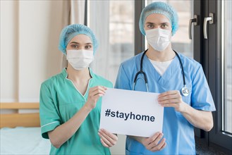 Nurses with stay home message
