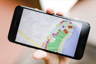 Close up person s hand holding smartphone with map gps navigation