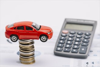 Toy car coin stack with calculator report
