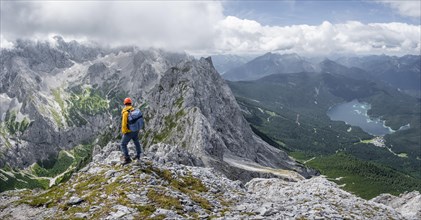 Mountaineer at the summit of the Waxenstein