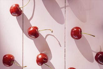 High angle view red cherries wooden plank