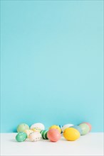 Different colored easter eggs table