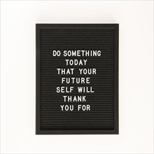 Black motivational text board top view