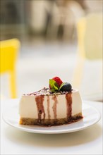 Homemade cheesecake with fresh berries mint dessert plate